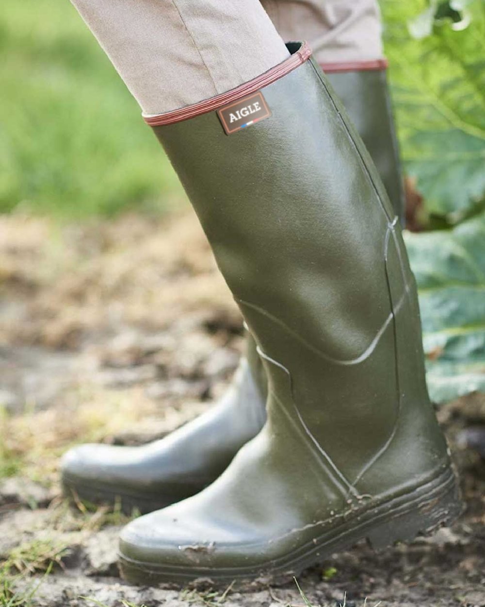Khaki coloured Aigle Chambord Pro 2 Wellington Boots on mud background #colour_khaki