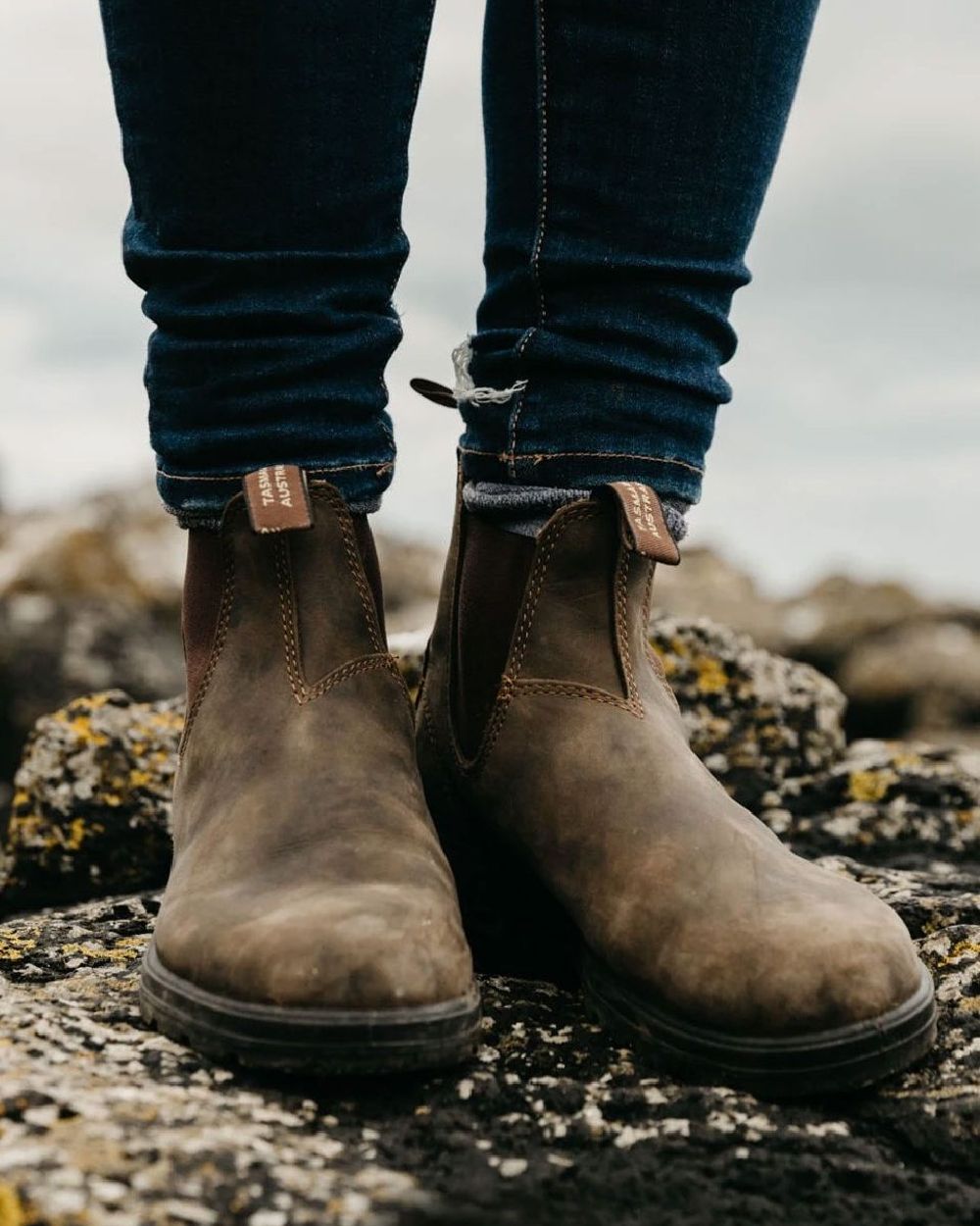 Rustic Brown coloured Blundstone Classic 585 Chelsea Boots on rock background #colour_rustic-brown