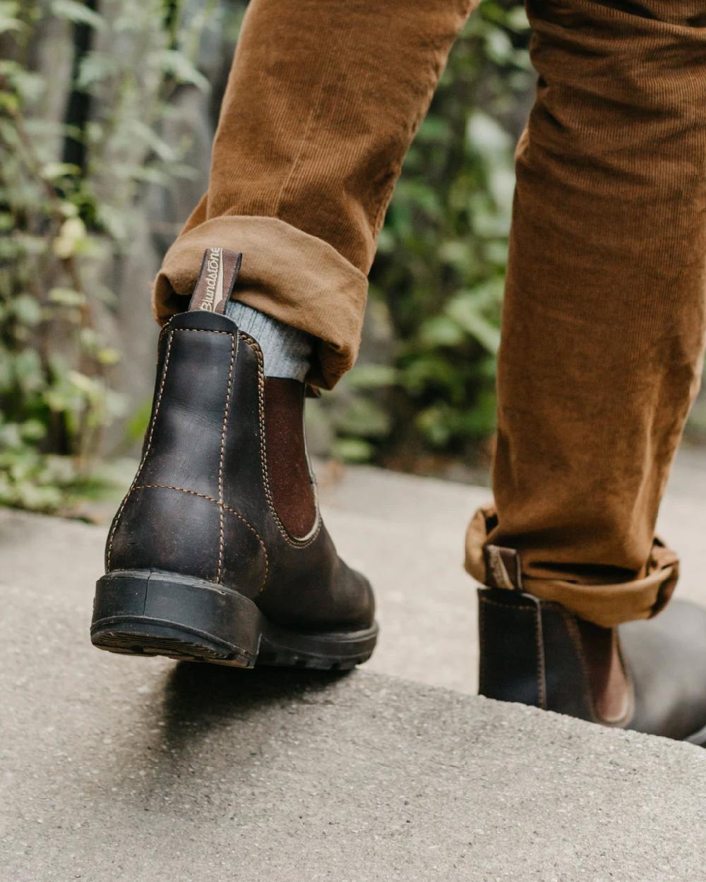 Stout Brown coloured Blundstone Original 500 Chelsea Boots on stairs background #colour_stout-brown