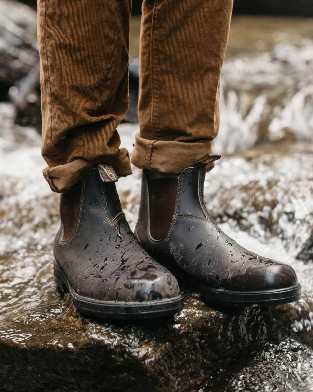 Stout Brown coloured Blundstone Original 500 Chelsea Boots on waterfall background #colour_stout-brown