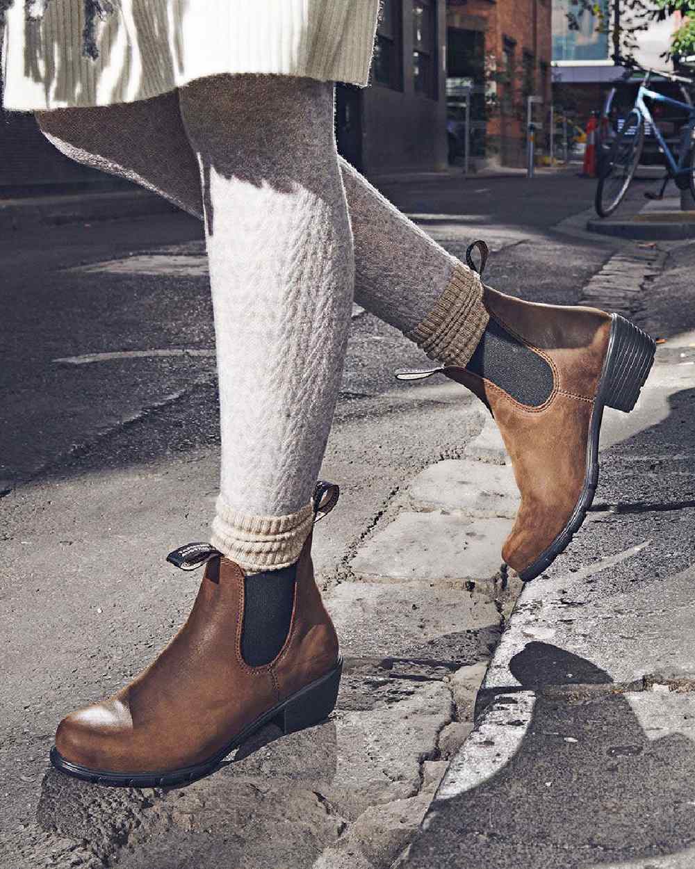 Antique Brown coloured Blundstone Womens 1673 Chelsea Boots on street background #colour_antique-brown