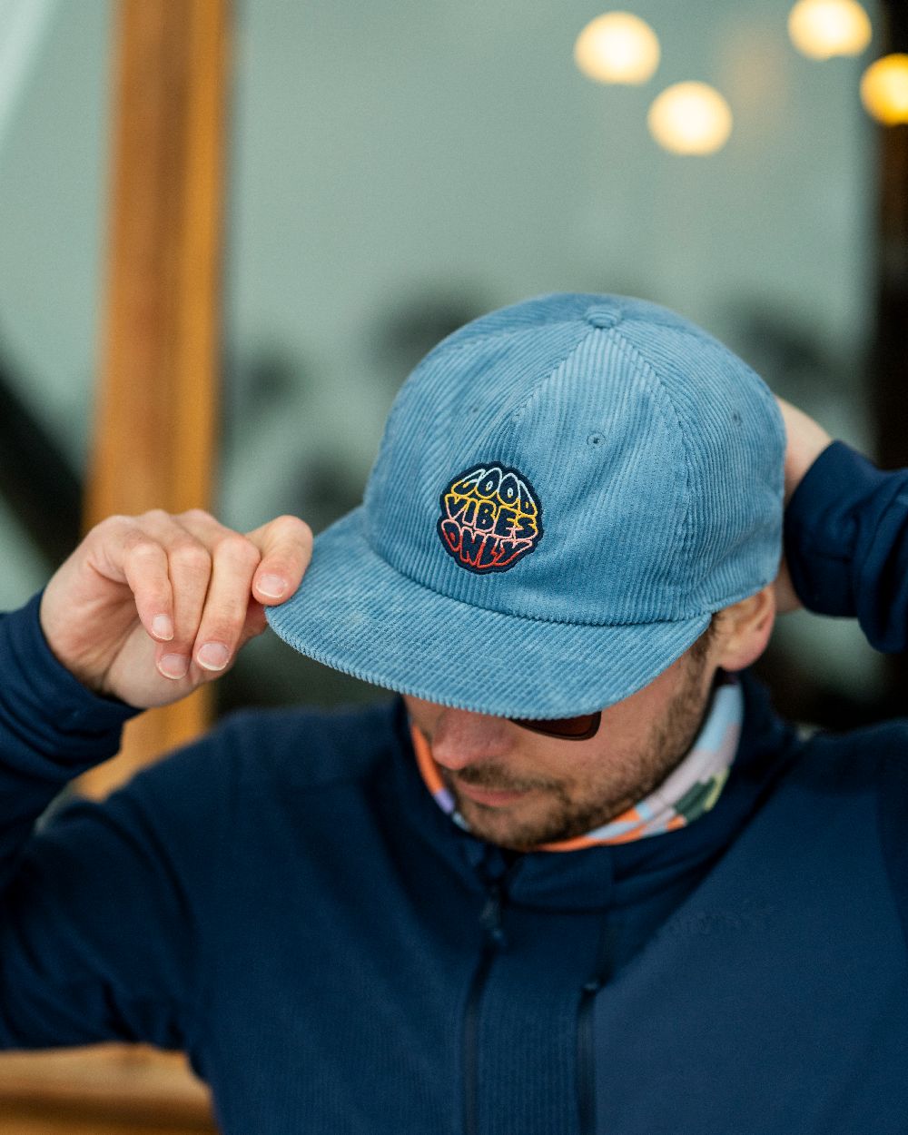 Water Coloured Buff Dister Chill Trucker Cap on blurry background #colour_water
