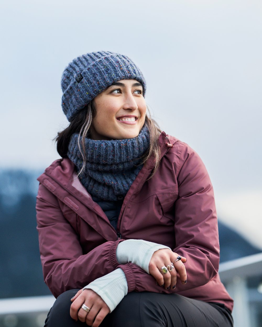 Water Coloured Buff Kim Knitted Fleece Neckwarmer on blurry background #colour_water