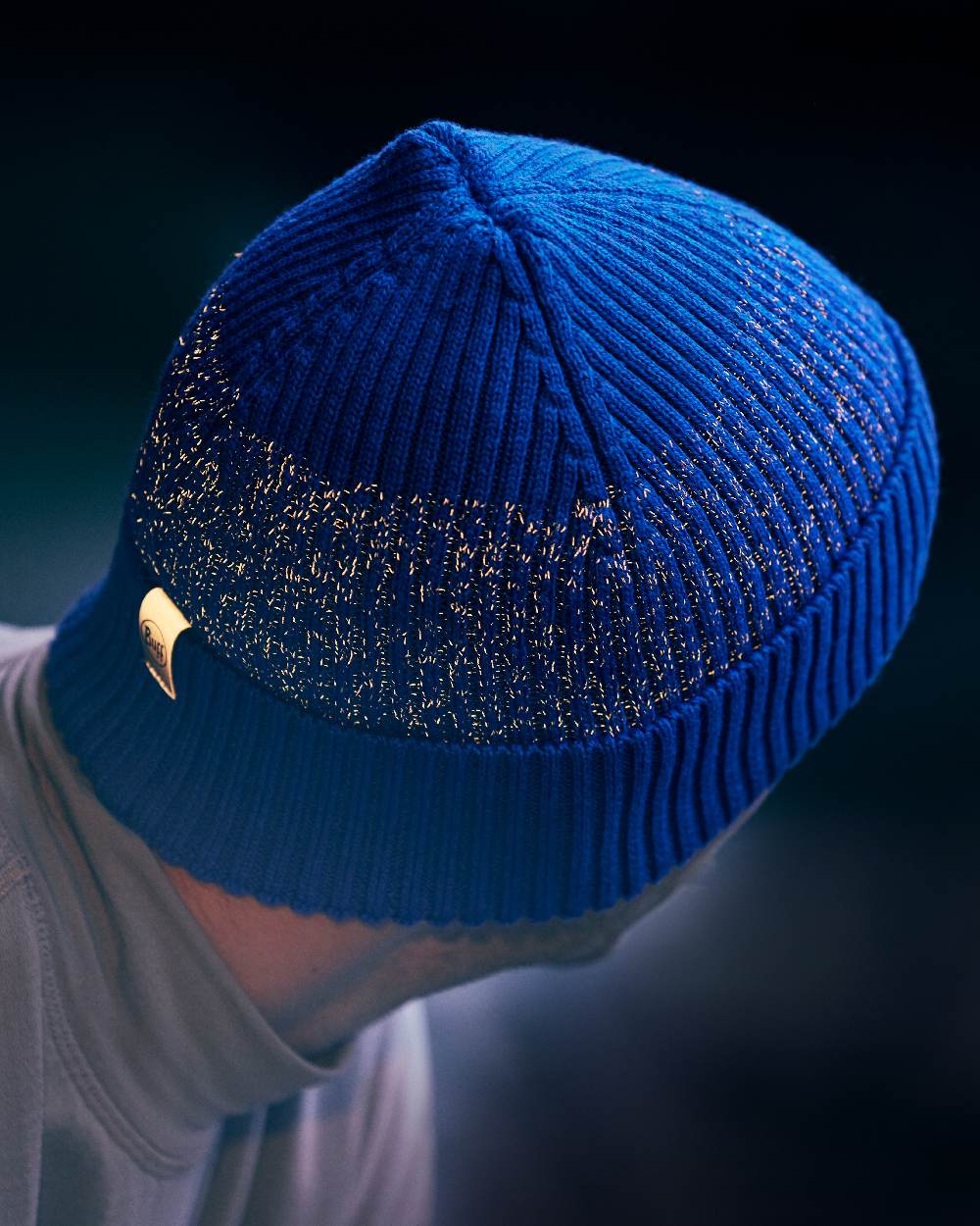 Cobalt Coloured Buff Merino Active Beanie on blurry background #colour_cobalt