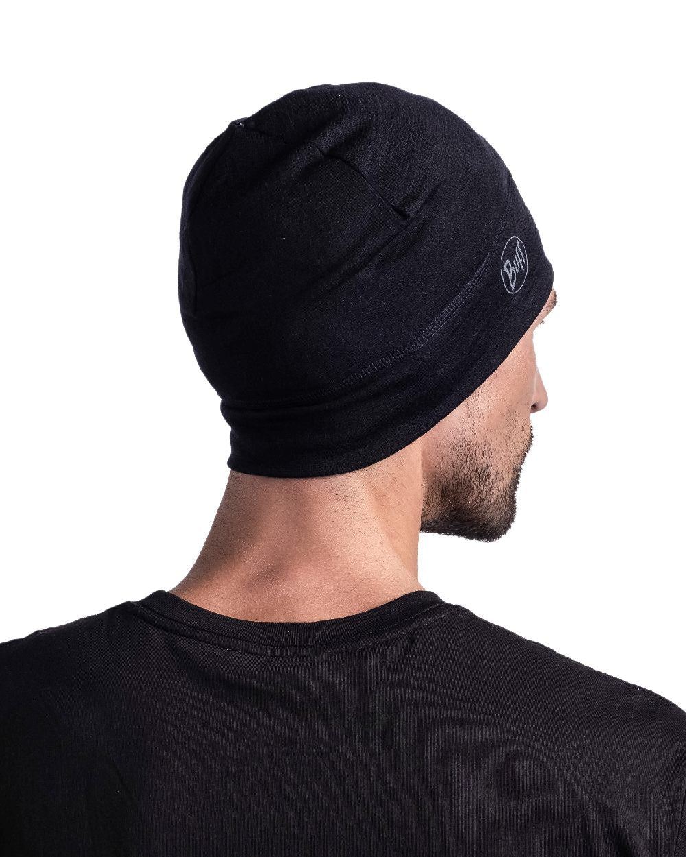 Black Coloured Buff Merino Lightweight Beanie on white background #colour_black