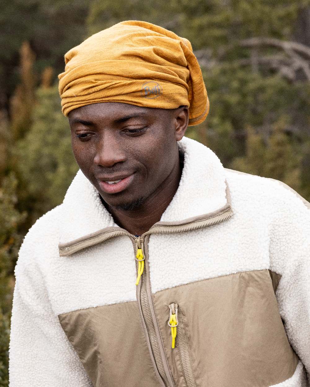 Mustard Coloured Buff Merino Lightweight Neck Warmer on outdoor background #colour_mustard