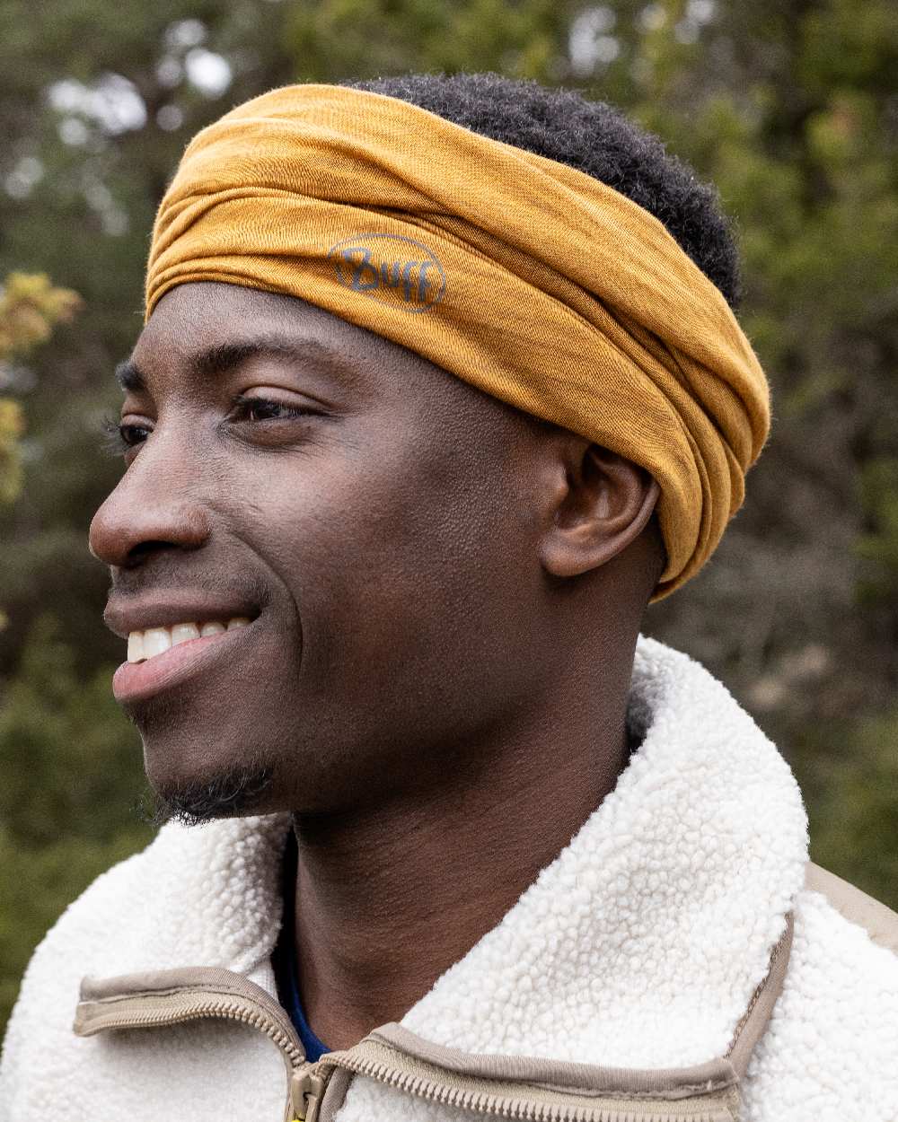 Mustard Coloured Buff Merino Lightweight Neck Warmer on outdoor background #colour_mustard
