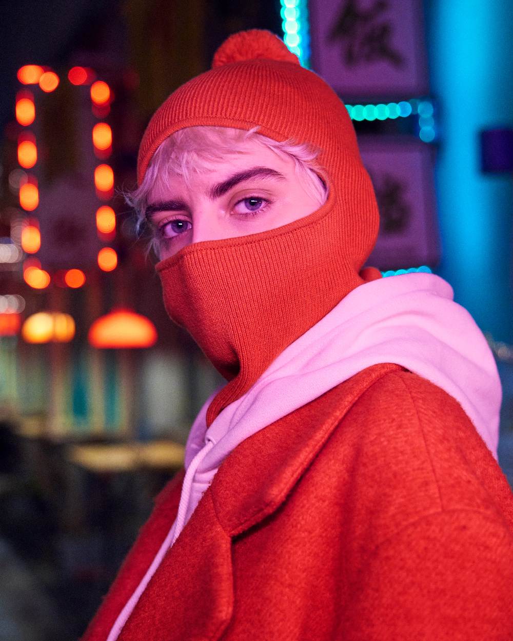 Orange Red Coloured Buff Nilan Knitted Balaclava on club background #colour_orange-red