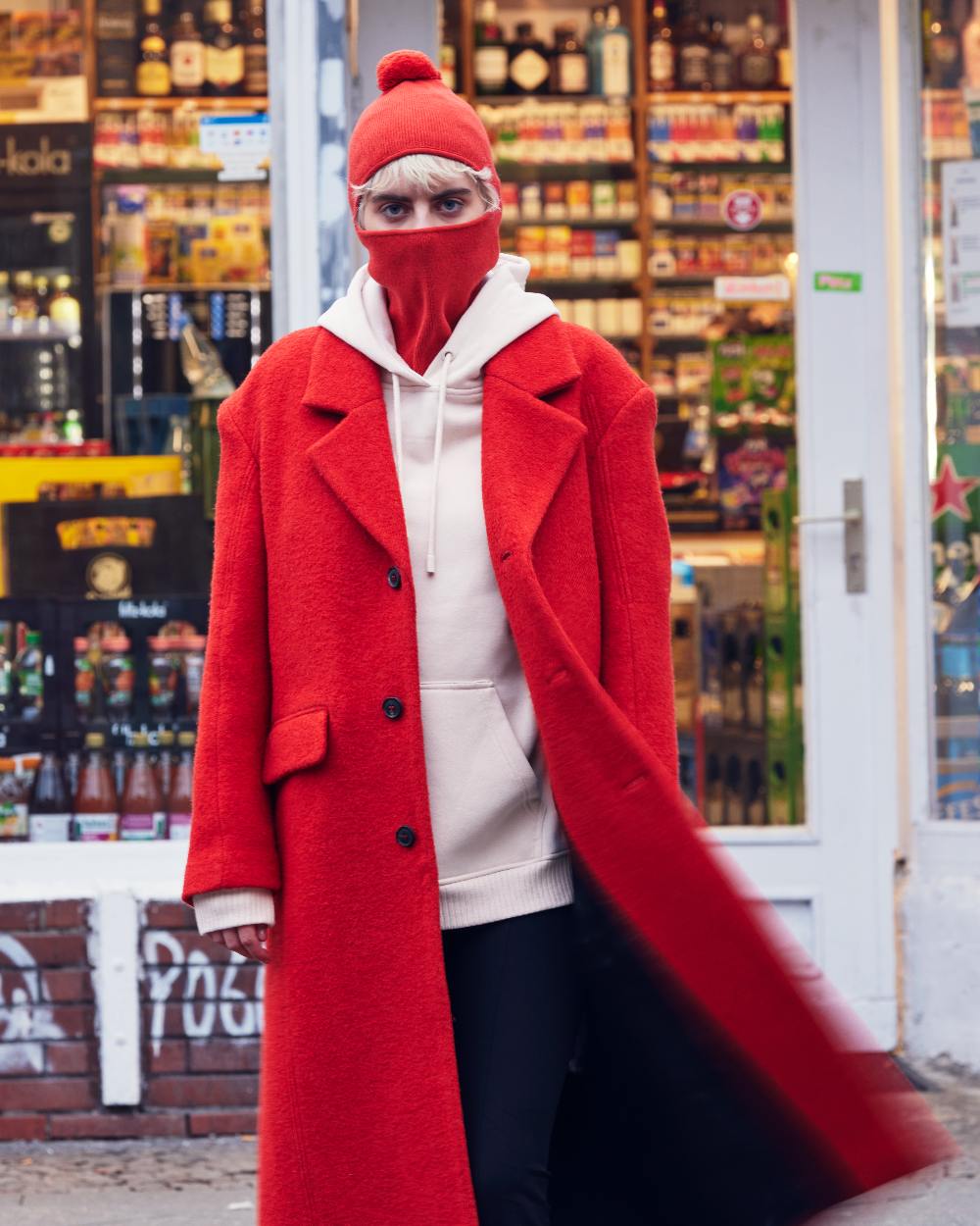Orange Red Coloured Buff Nilan Knitted Balaclava on shops background #colour_orange-red