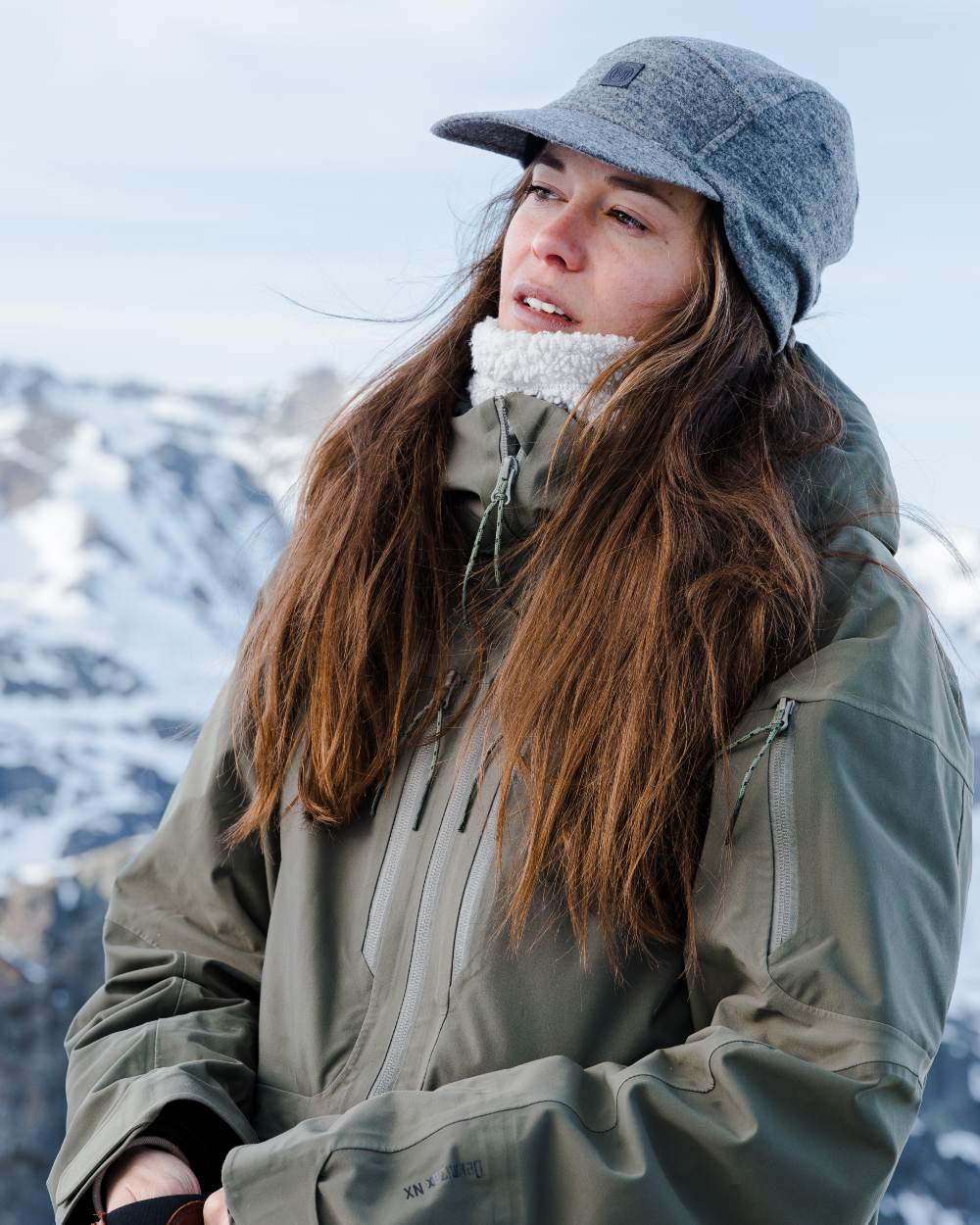 Grey Coloured Buff Pack Merino Fleece Cap on snow background #colour_grey
