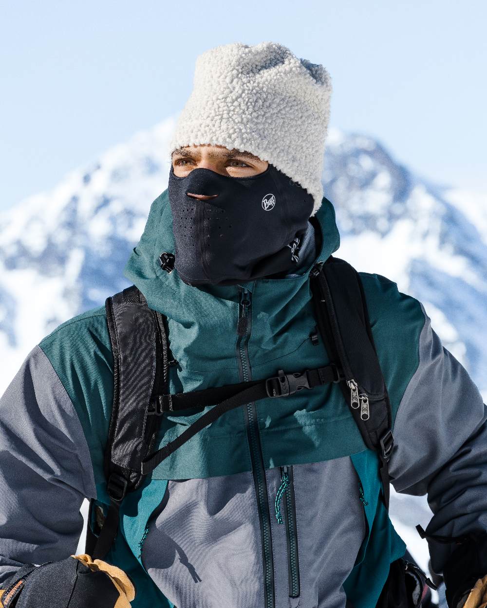 Black Coloured Buff Windproof Solid Balaclava on snow background #colour_black