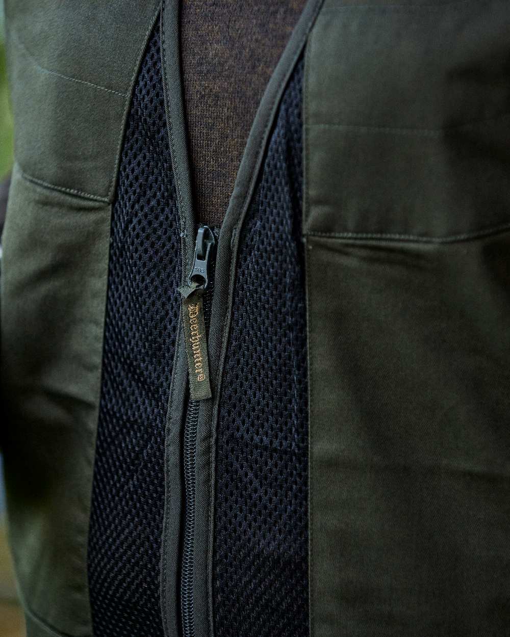 Timber coloured Deerhunter Atlas Mesh Shooting Waistcoat on blurry background #colour_timber