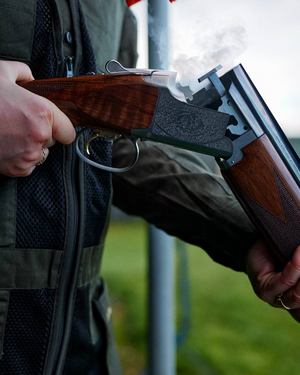 Timber coloured Deerhunter Atlas Mesh Shooting Waistcoat on blurry background #colour_timber