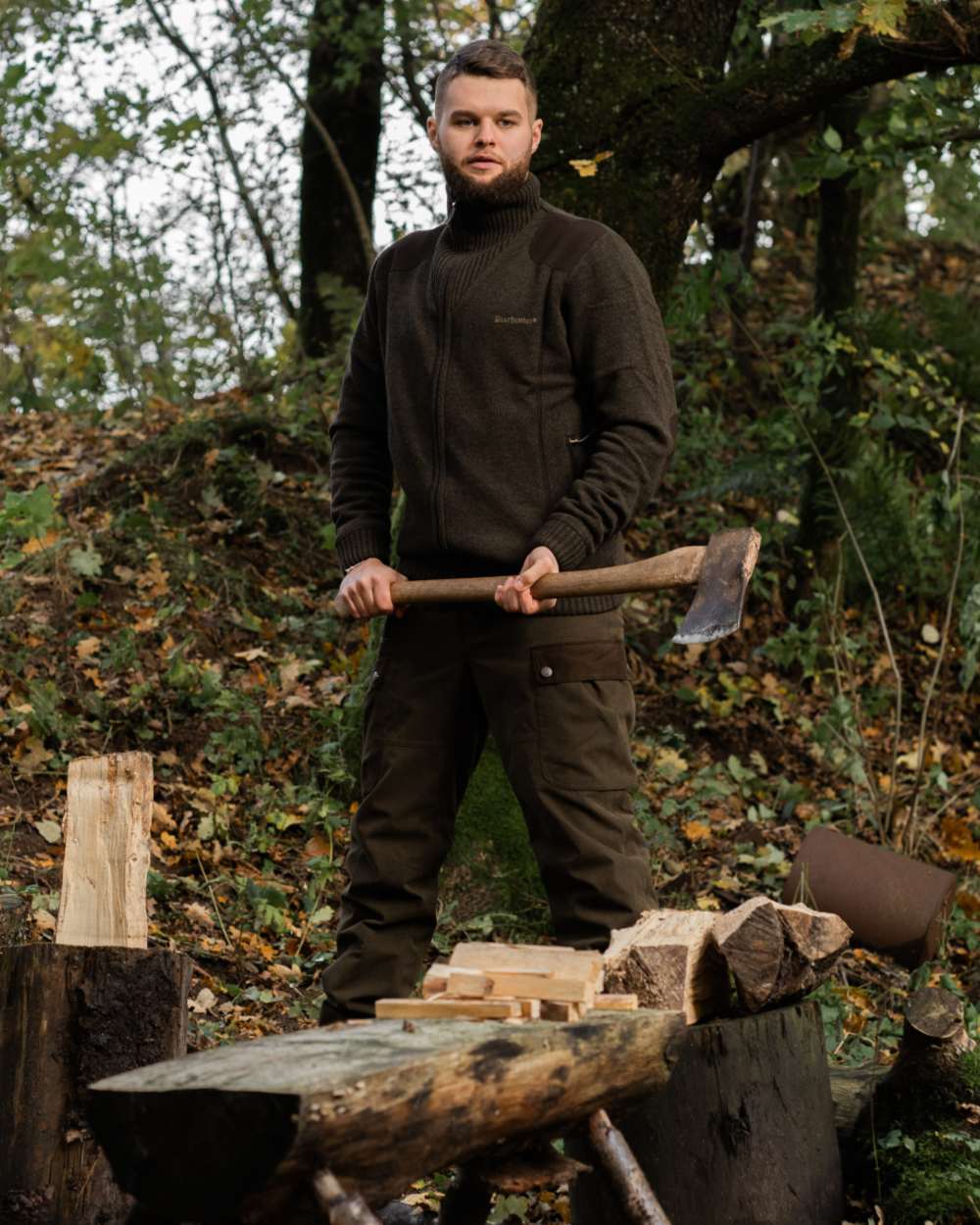 Dark Elm Melange coloured Deerhunter Carlisle Knit Cardigan With Stormliner on forest background #colour_dark-elm