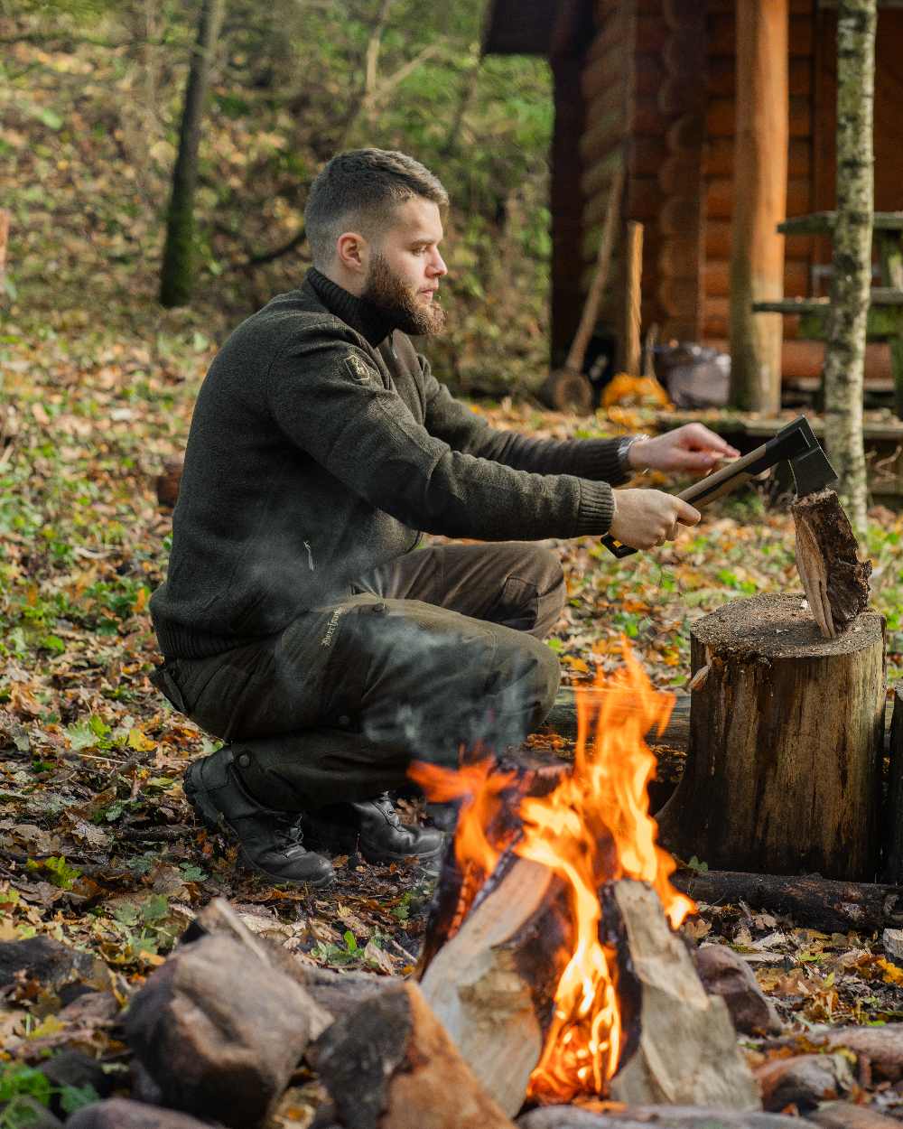 Dark Elm Melange coloured Deerhunter Carlisle Knit Cardigan With Stormliner on forest background #colour_dark-elm