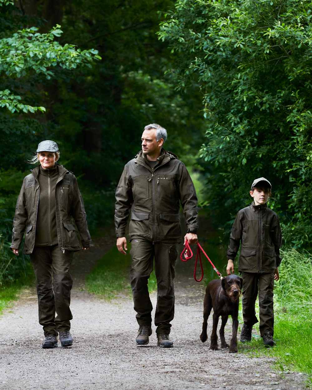 Olive Green Melange Coloured Deerhunter Chasse Jacket on forest background #colour_olive-green-melange