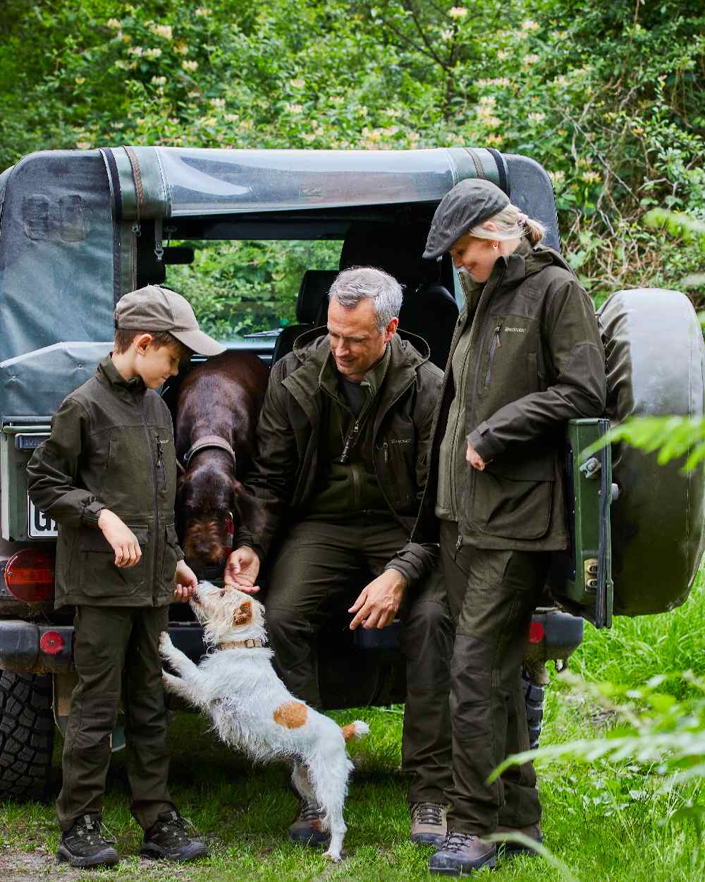 Olive Night Melange coloured Deerhunter Chasse Trousers on tree background #colour_olive-night-melange