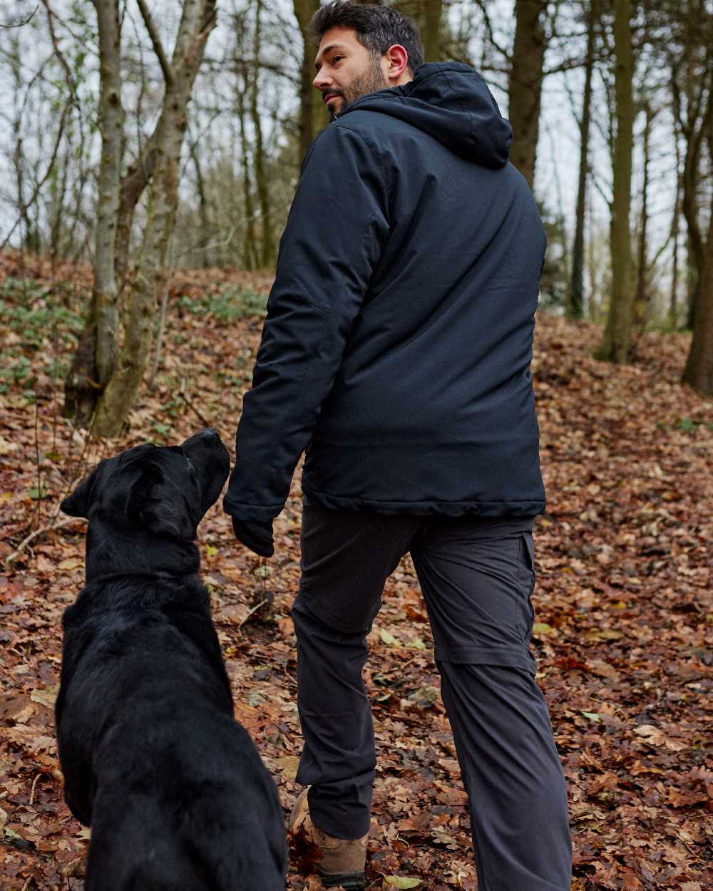 Dark Blue coloured Deerhunter Denver Winter Jacket on forest background #colour_dark-blue