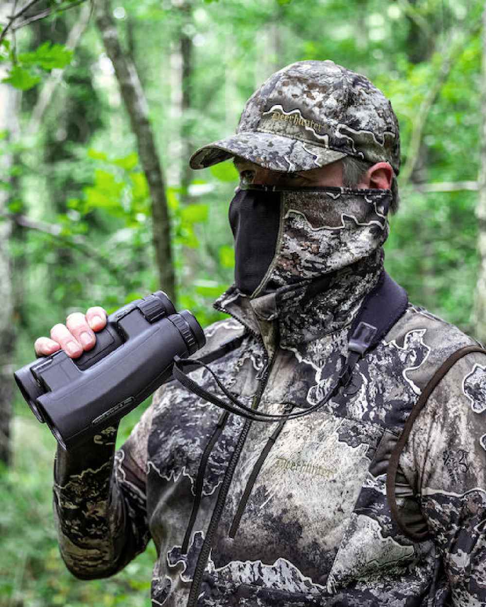 Realtree Excape coloured Deerhunter Excape Facemask on forest background #colour_realtree-excape