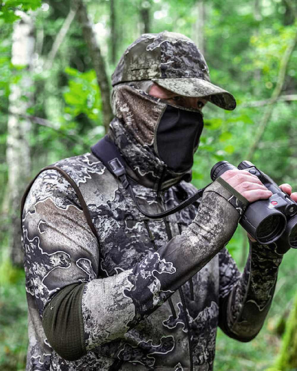 Realtree Excape coloured Deerhunter Excape Facemask on forest background #colour_realtree-excape