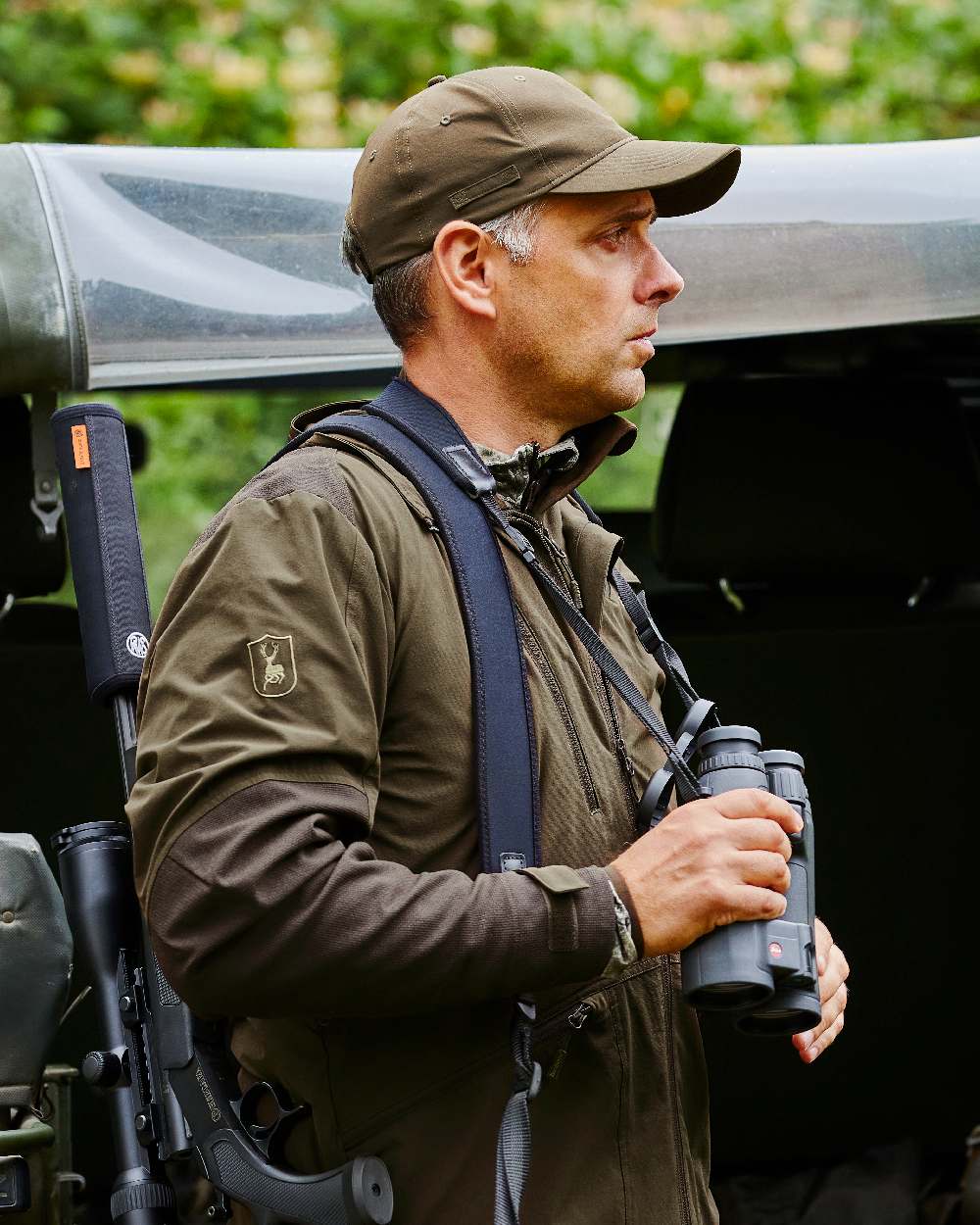 Art Green coloured Deerhunter Excape Light Jacket on jeep background #colour_art-green