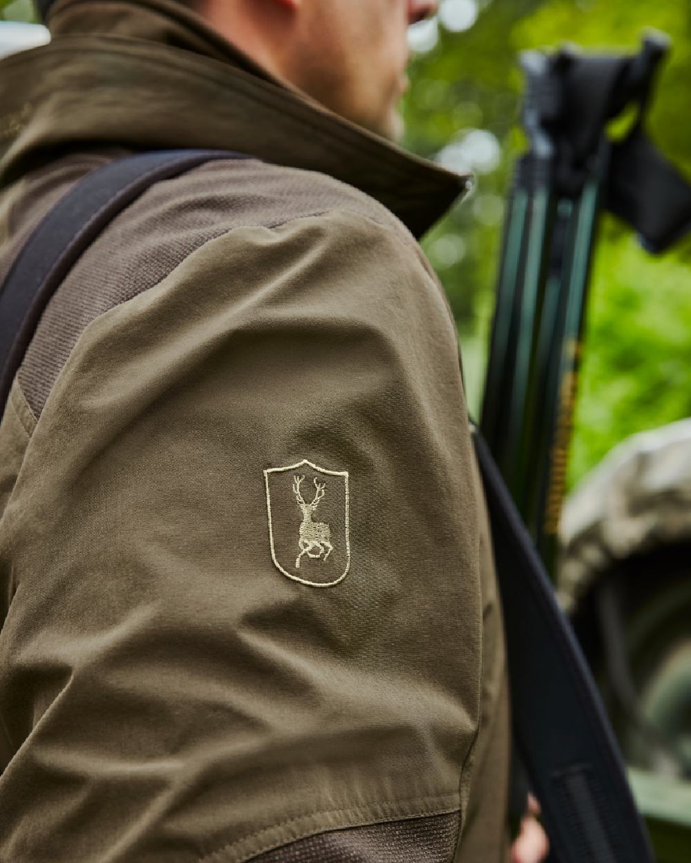 Art Green coloured Deerhunter Excape Light Jacket on blurry background #colour_art-green