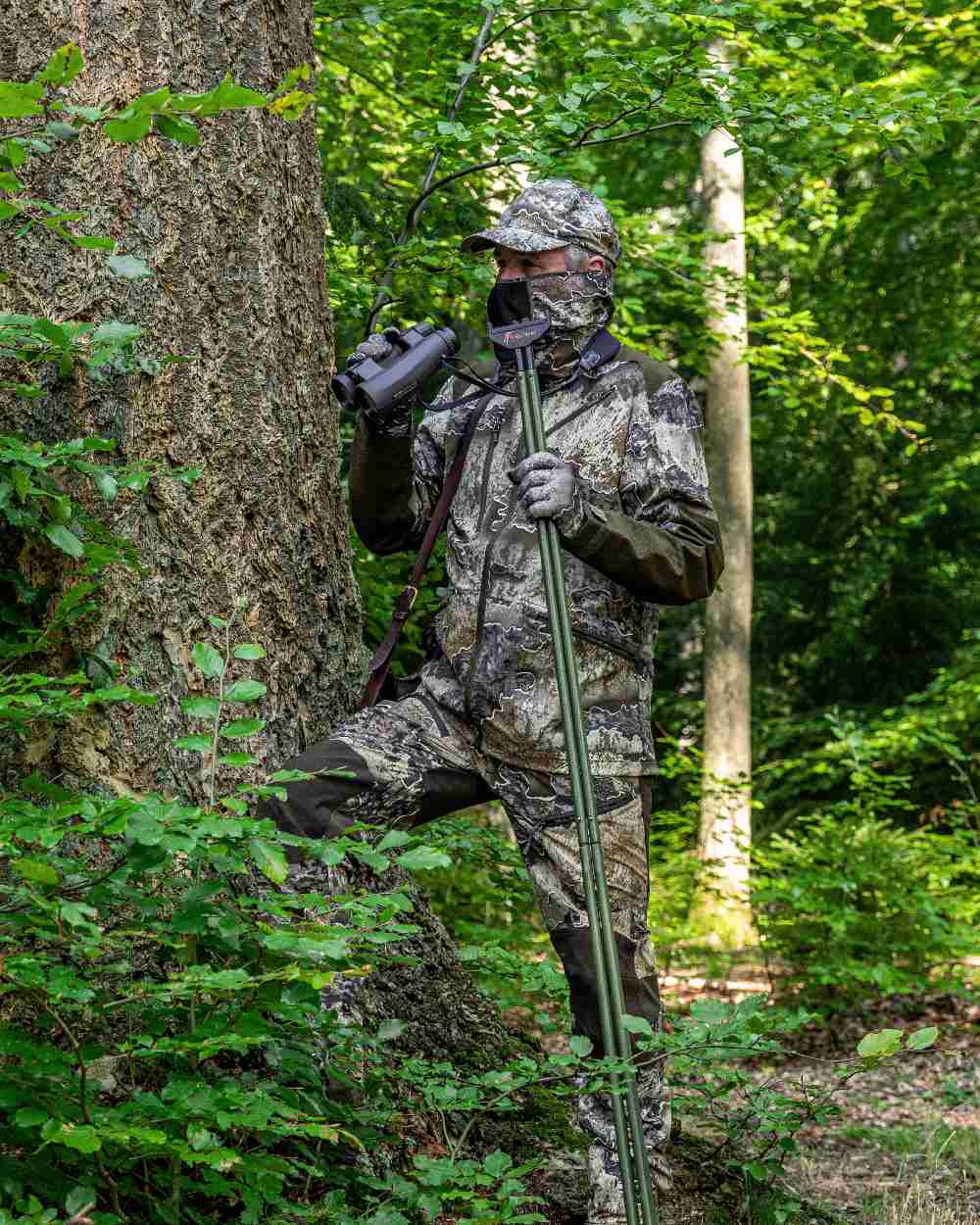 Realtree Excape coloured Deerhunter Excape Light Jacket on forest background #colour_realtree-excape