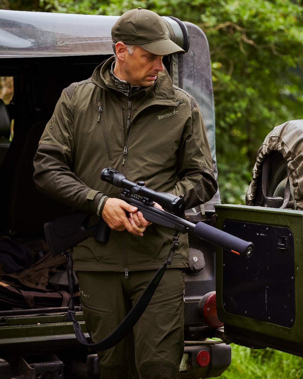Art Green coloured Deerhunter Excape Light Trousers on jeep background #colour_art-green