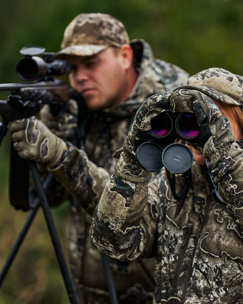 Realtree Excape coloured Deerhunter Excape Mittens on forest background #colour_realtree-excape