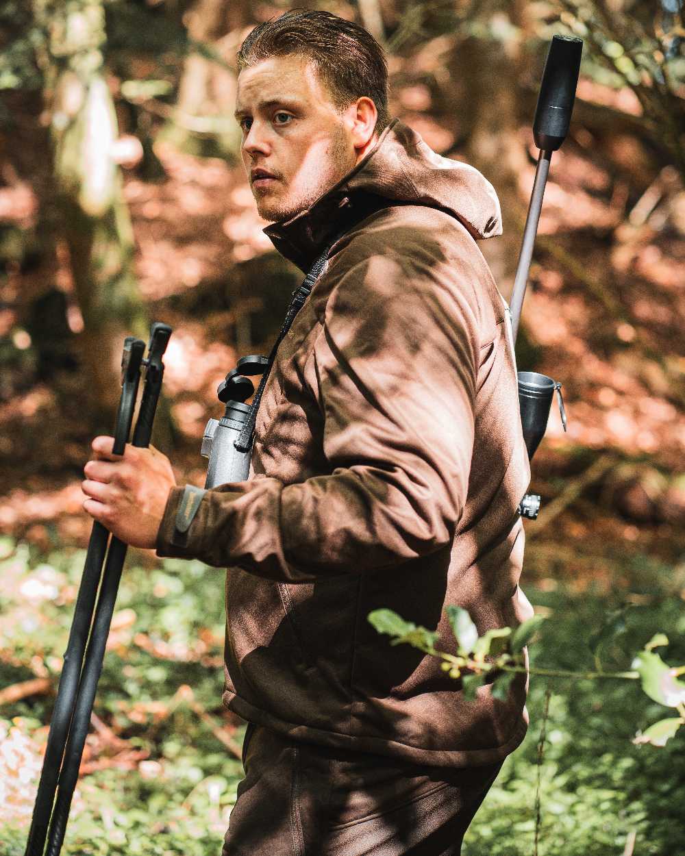 Art Green coloured Deerhunter Excape Softshell Jacket on forest background #colour_art-green