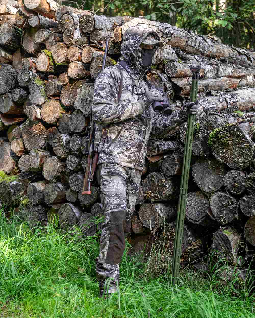 Realtree Excape coloured Deerhunter Excape Softshell Trousers on forest background #colour_realtree-excape
