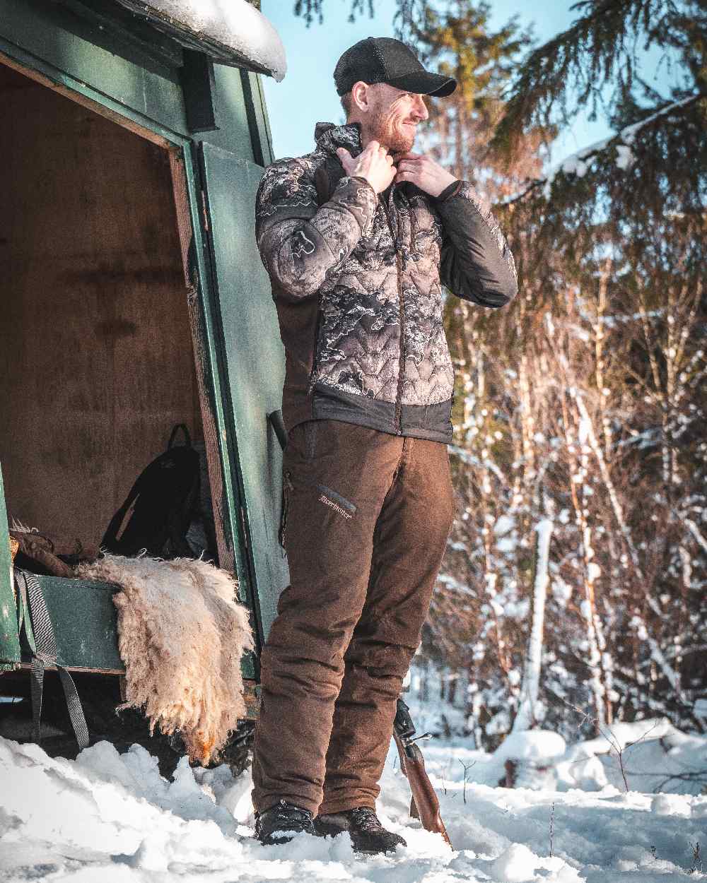 Art Green coloured Deerhunter Excape Winter Waterproof Trousers on snow background #colour_art-green