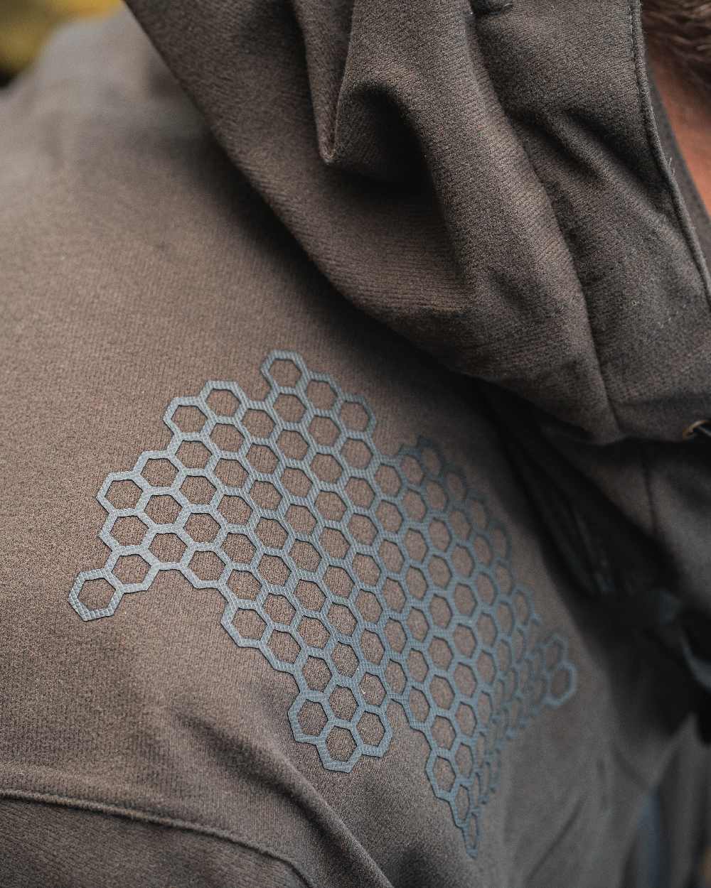 Wood coloured Deerhunter Game Pro Light Jacket on blurry background #colour_wood