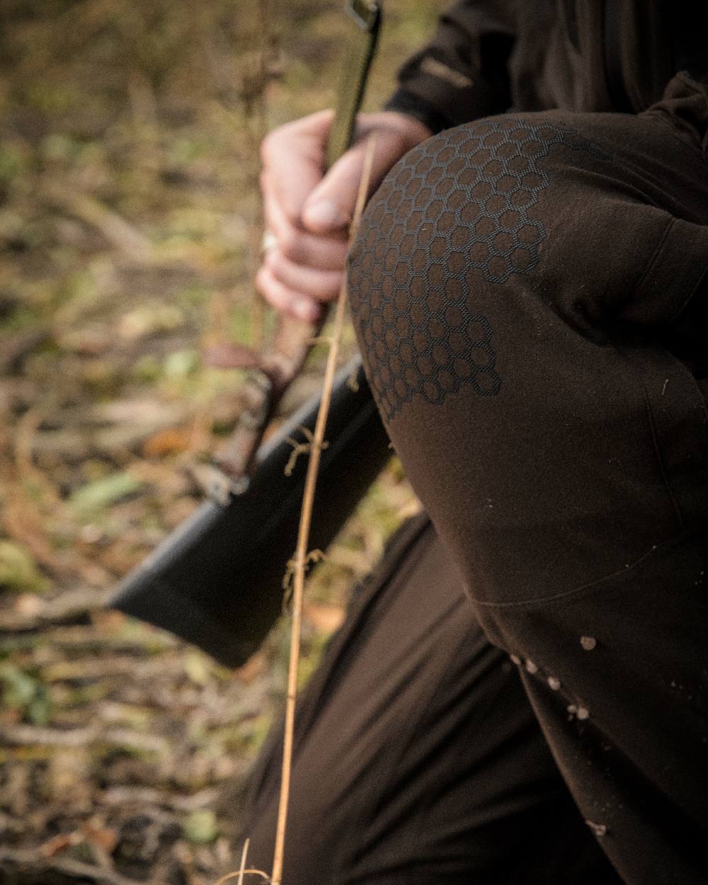 Wood coloured Deerhunter Game Pro Light Trousers on blurry background #colour_wood