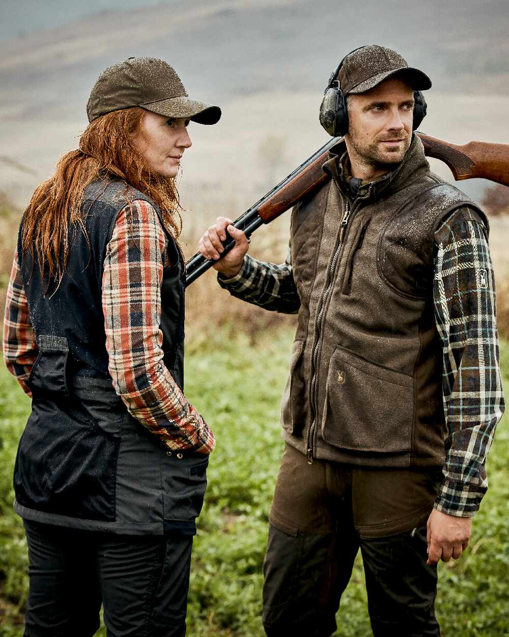 Graphite Green Coloured Deerhunter Gamekeeper Shooting Waistcoat on forest background #colour_graphite-green
