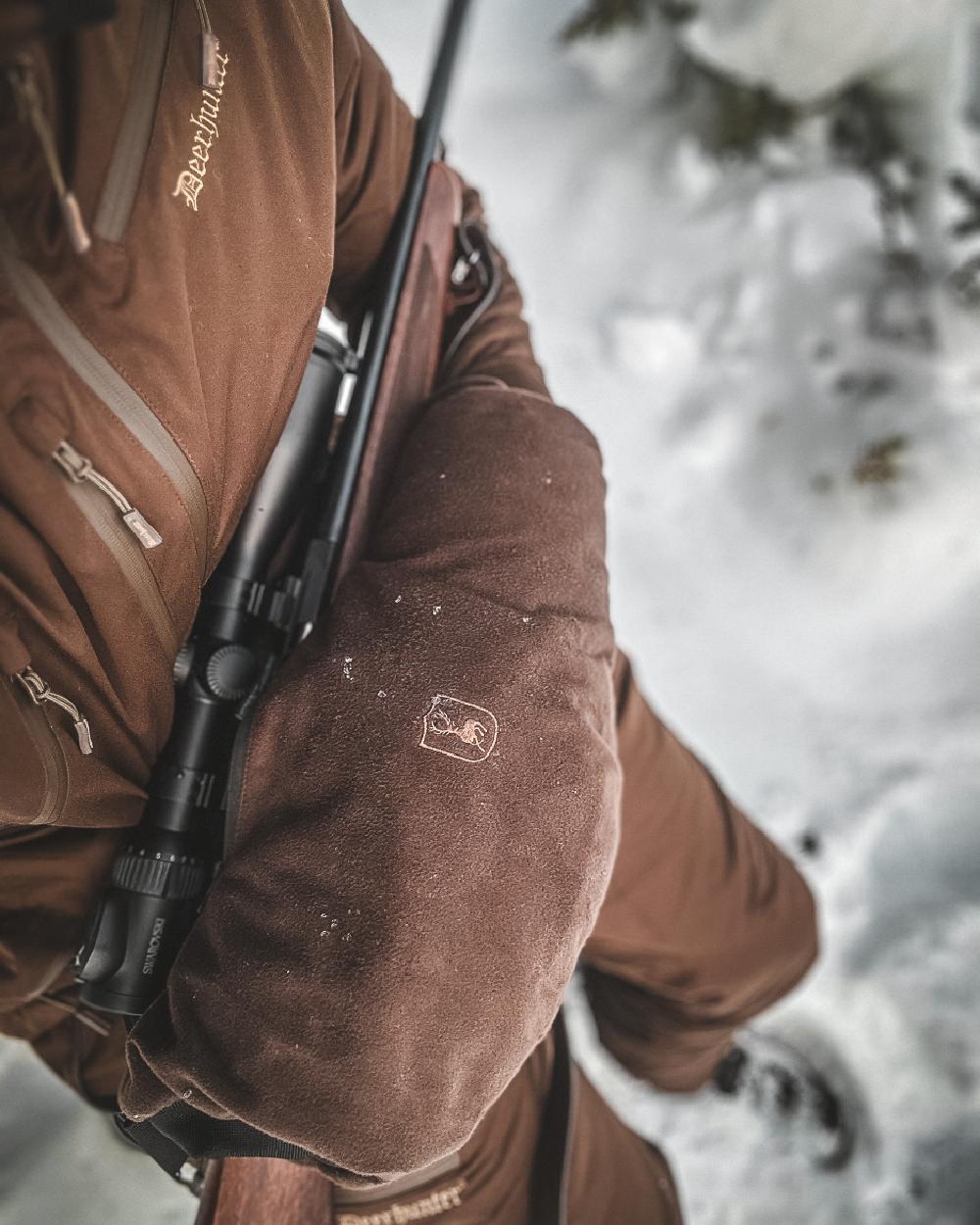 Wood coloured Deerhunter Heat Handwarmer on snow background #colour_wood