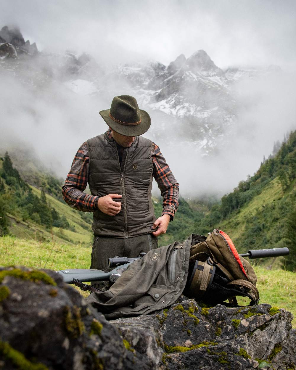 Deep Green Coloured Deerhunter Heat Inner Waistcoat on mountain background #colour_deep-green
