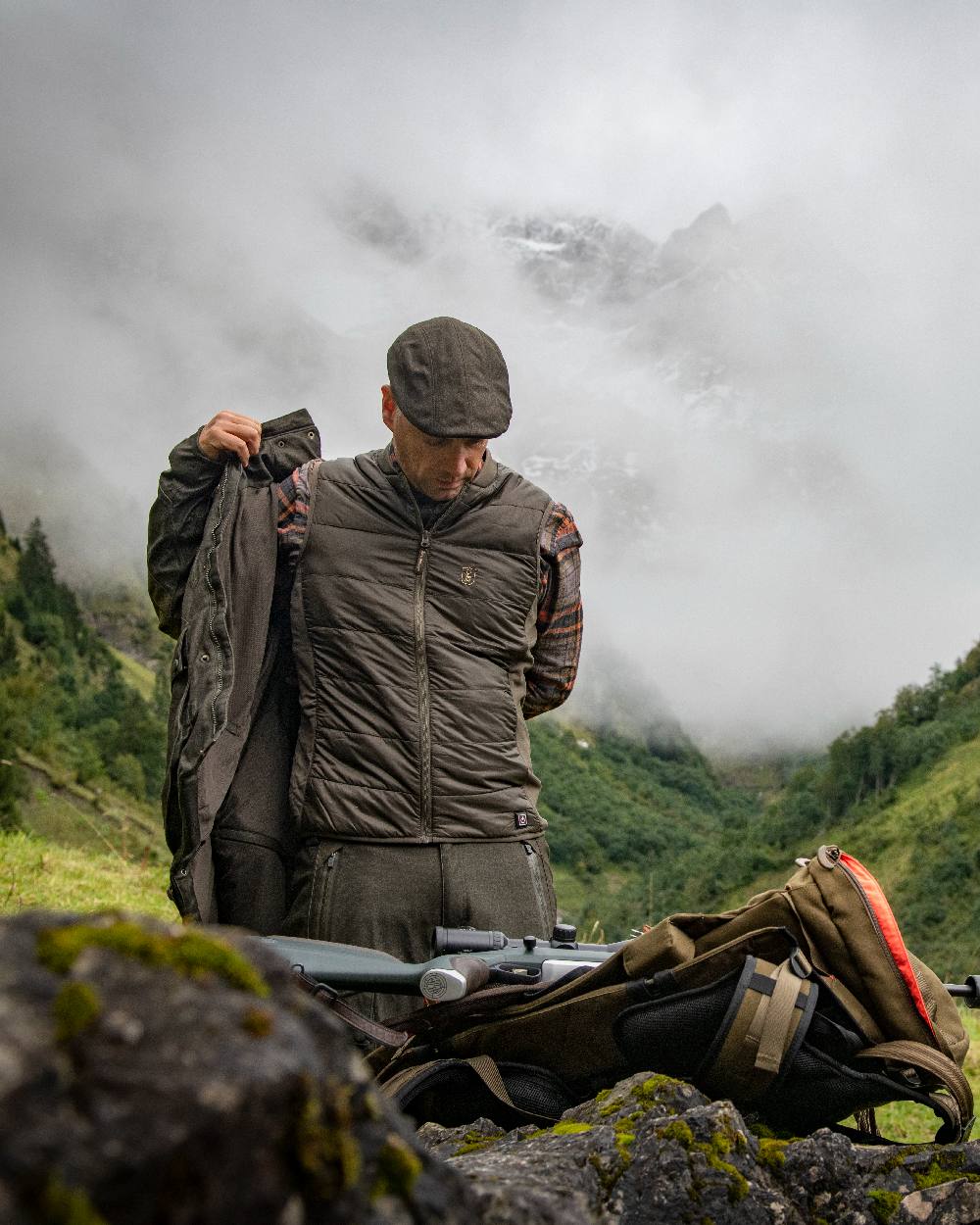 Deep Green Coloured Deerhunter Heat Inner Waistcoat on mountain background #colour_deep-green