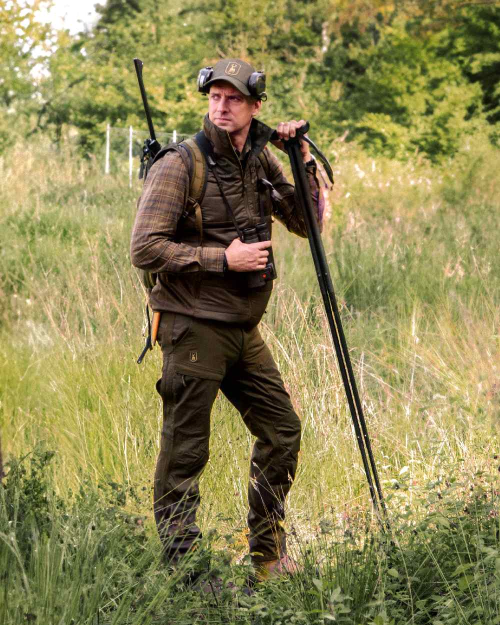 Wood Coloured Deerhunter Heat Padded Waistcoat on forest background #colour_wood