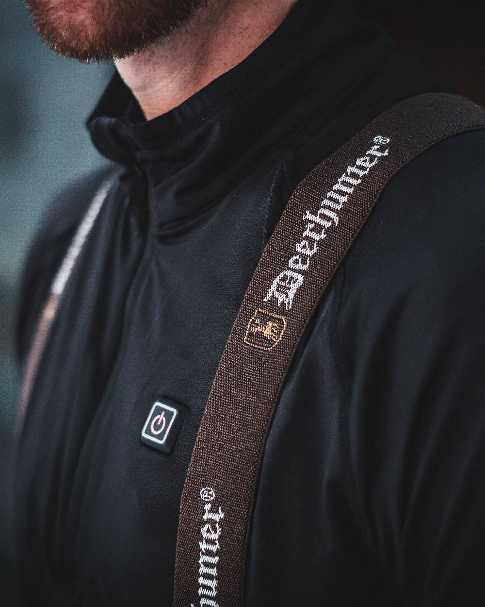 Black coloured Deerhunter Heat Undershirt with Zip Neck on blurry background #colour_black