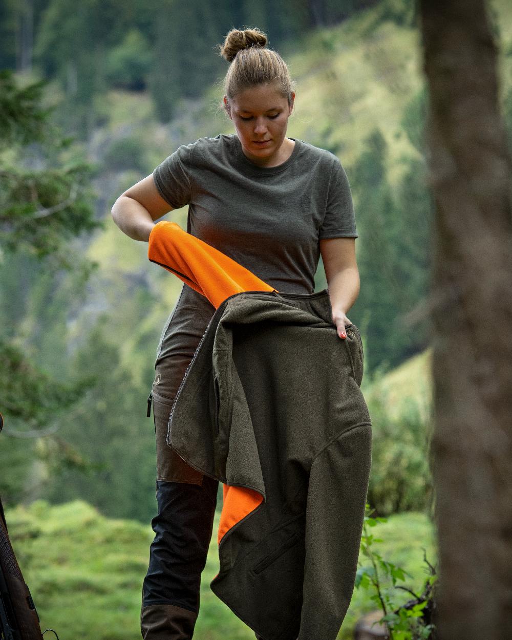 Adventure Green Melange coloured Deerhunter Ladies Basic 2-Pack T-Shirt on forest background #colour_adventure-green-melange