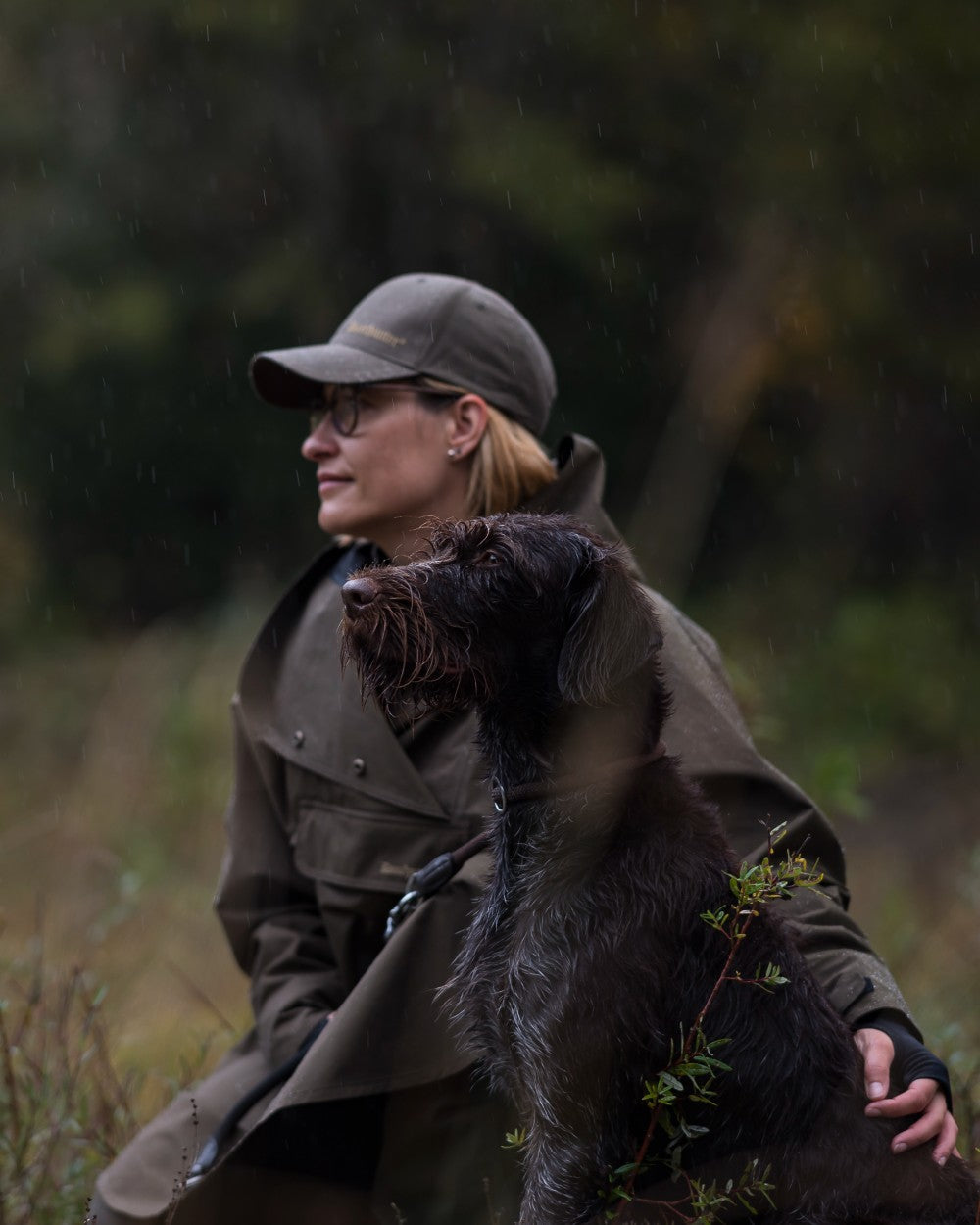 Canteen Coloured Deerhunter Ladies Waterproof Rain Poncho on blurry background #colour_canteen