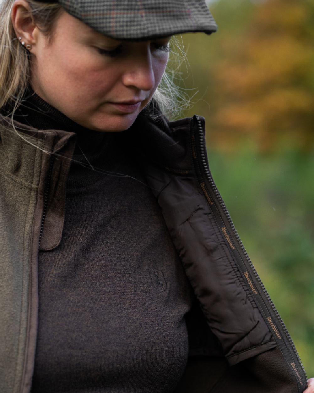 Dark Elm coloured Deerhunter Lady Darlington Roll Neck on blurry background #colour_dark-elm