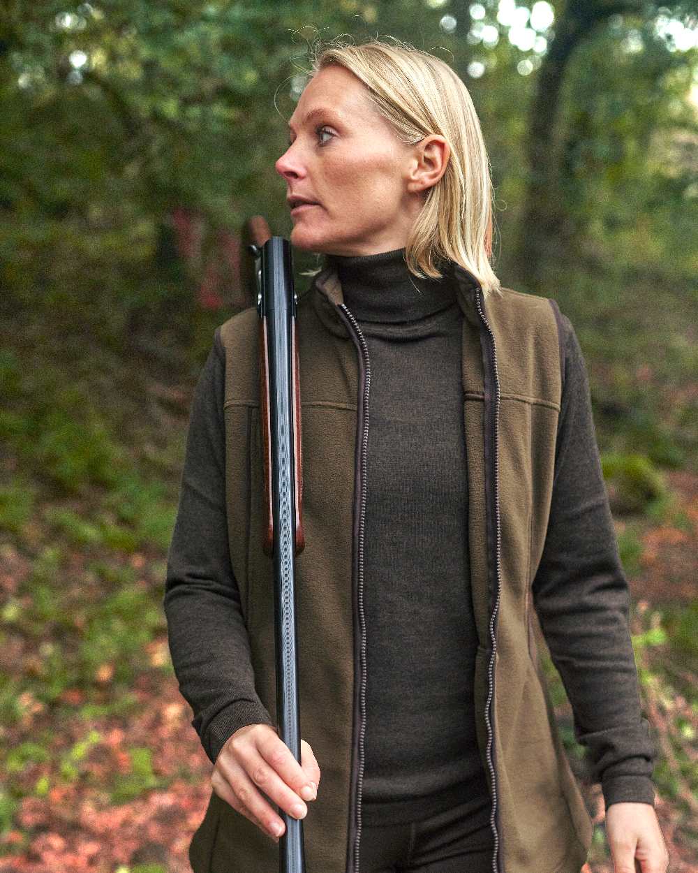 Dark Elm coloured Deerhunter Lady Darlington Roll Neck on blurry background #colour_dark-elm