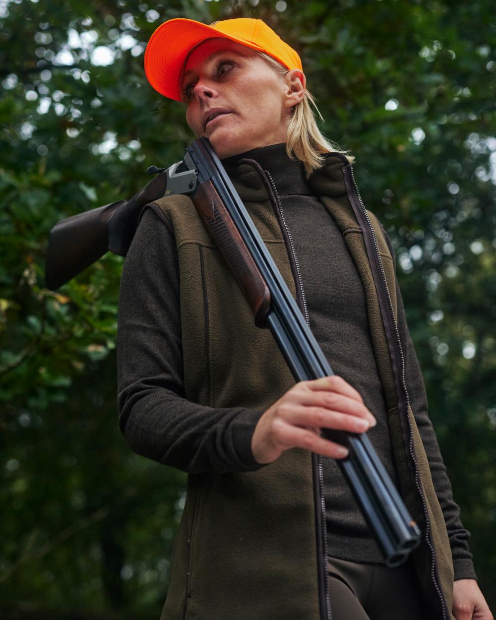 Tarmac Green Coloured Deerhunter Lady Eagle Fleece Waistcoat on forest background #colour_tarmac-green