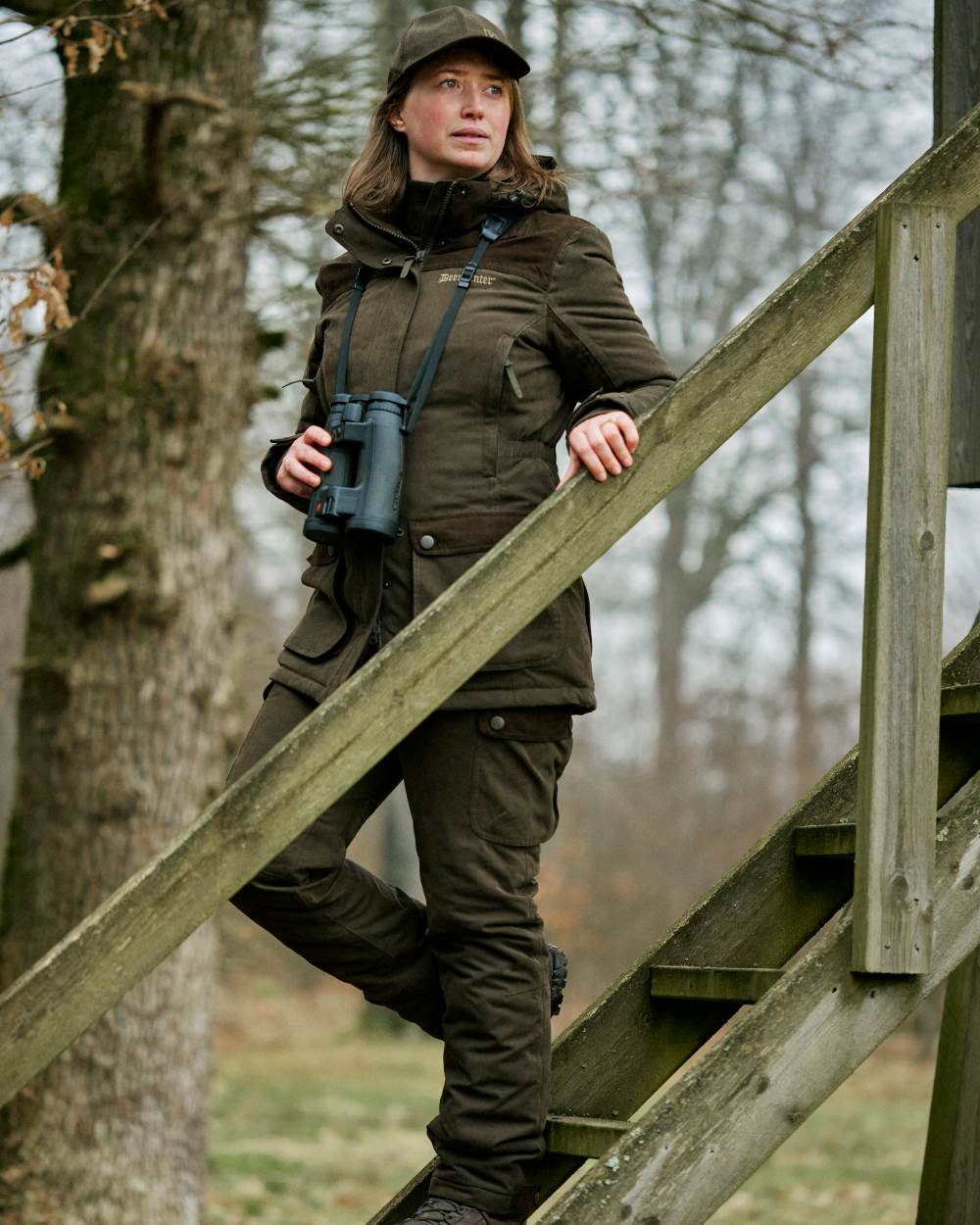 Tarmac Green coloured Deerhunter Lady Eagle Winter Jacket on forest background #colour_tarmac-green