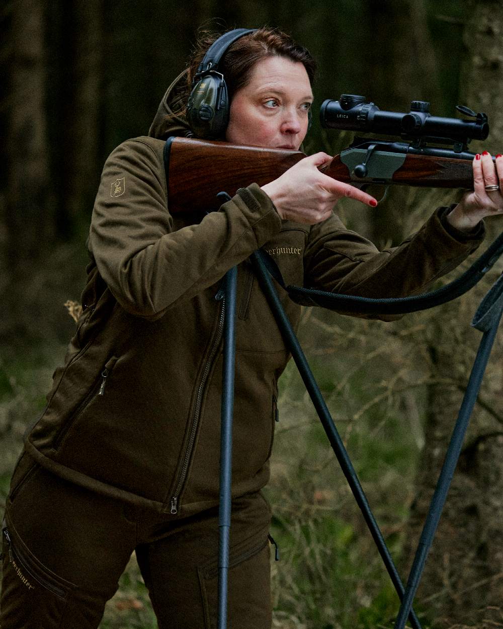 Art Green coloured Deerhunter Lady Excape Softshell Jacket on burry background #colour_art-green