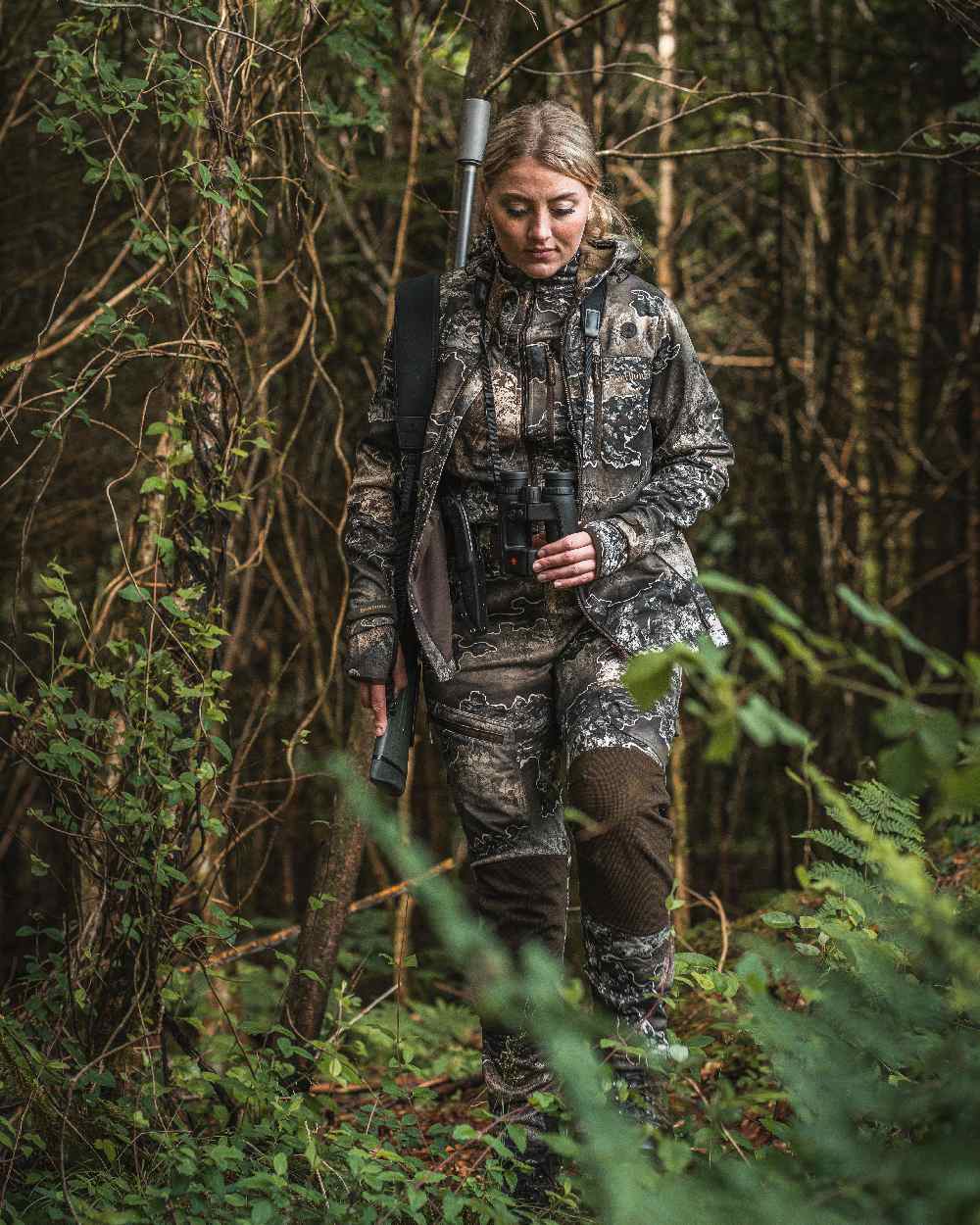 Realtree Excape coloured Deerhunter Lady Excape Softshell Jacket on forest background #colour_realtree-excape