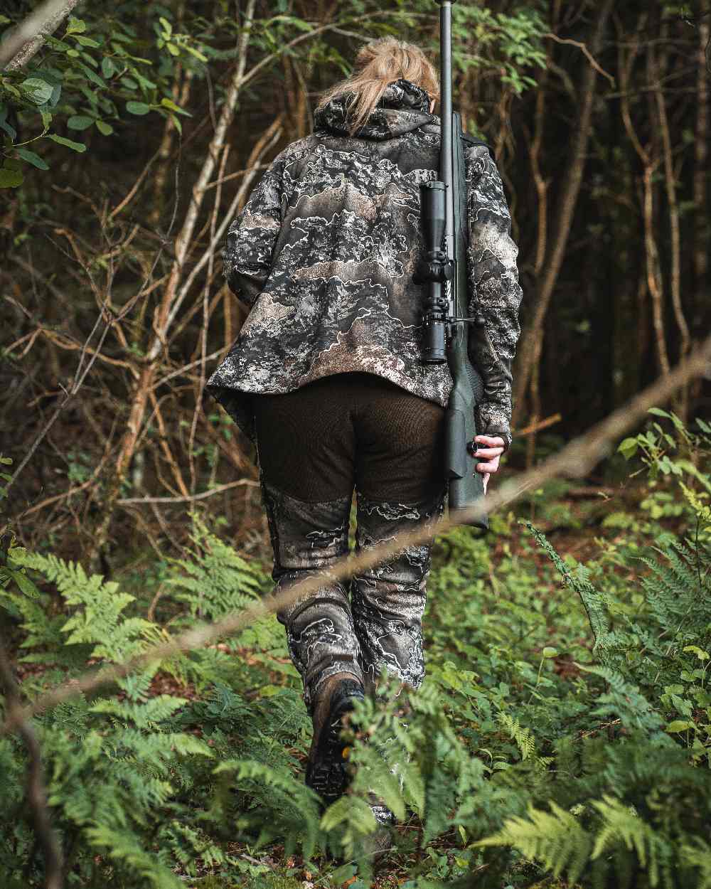 Realtree Excape coloured Deerhunter Lady Excape Softshell Jacket on forest background #colour_realtree-excape