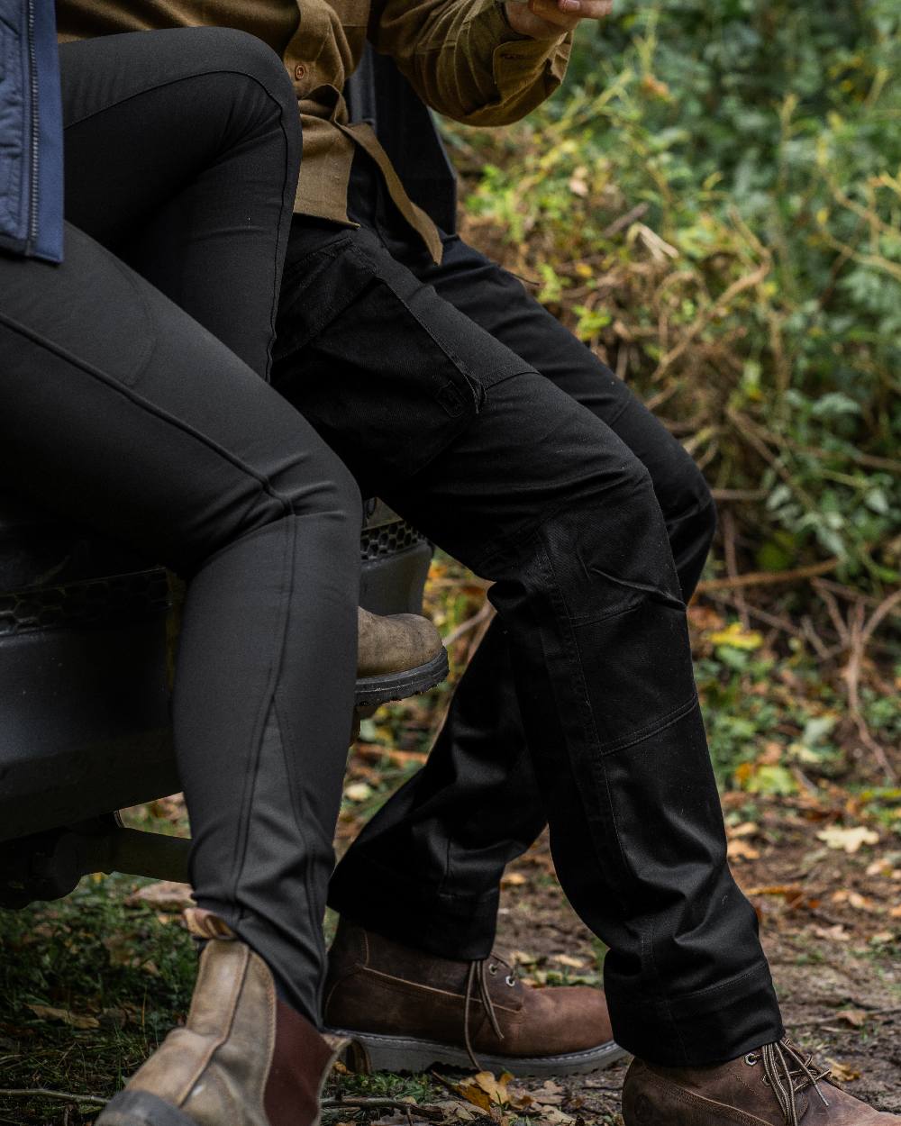 Black coloured Deerhunter Lady Hunting Tights on forest background #colour_black